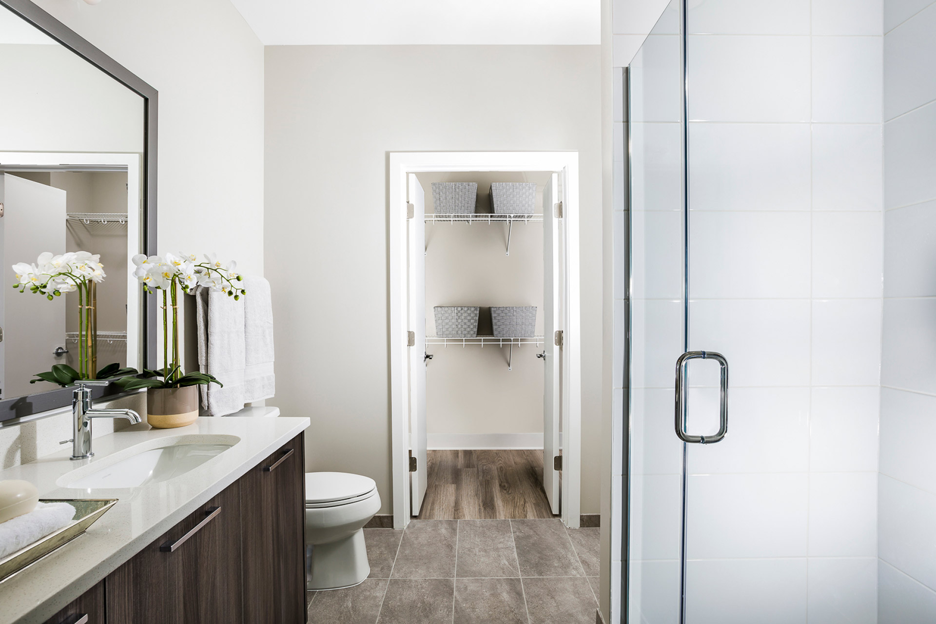 Standing showers, double vanities and Bluetooth mirrors are available in select apartment bathrooms.