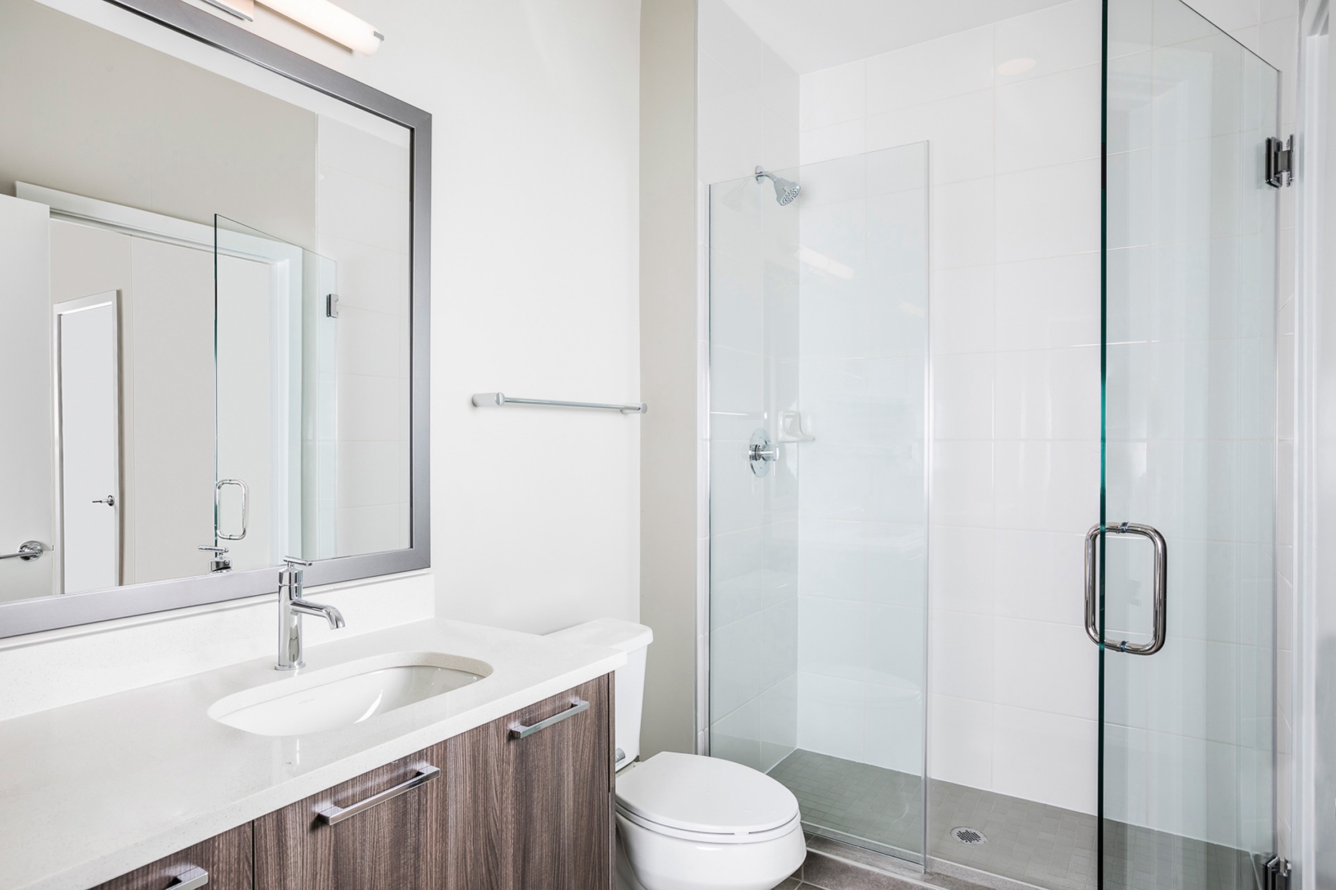 Standing showers, double vanities and Bluetooth mirrors are available in select apartment bathrooms.