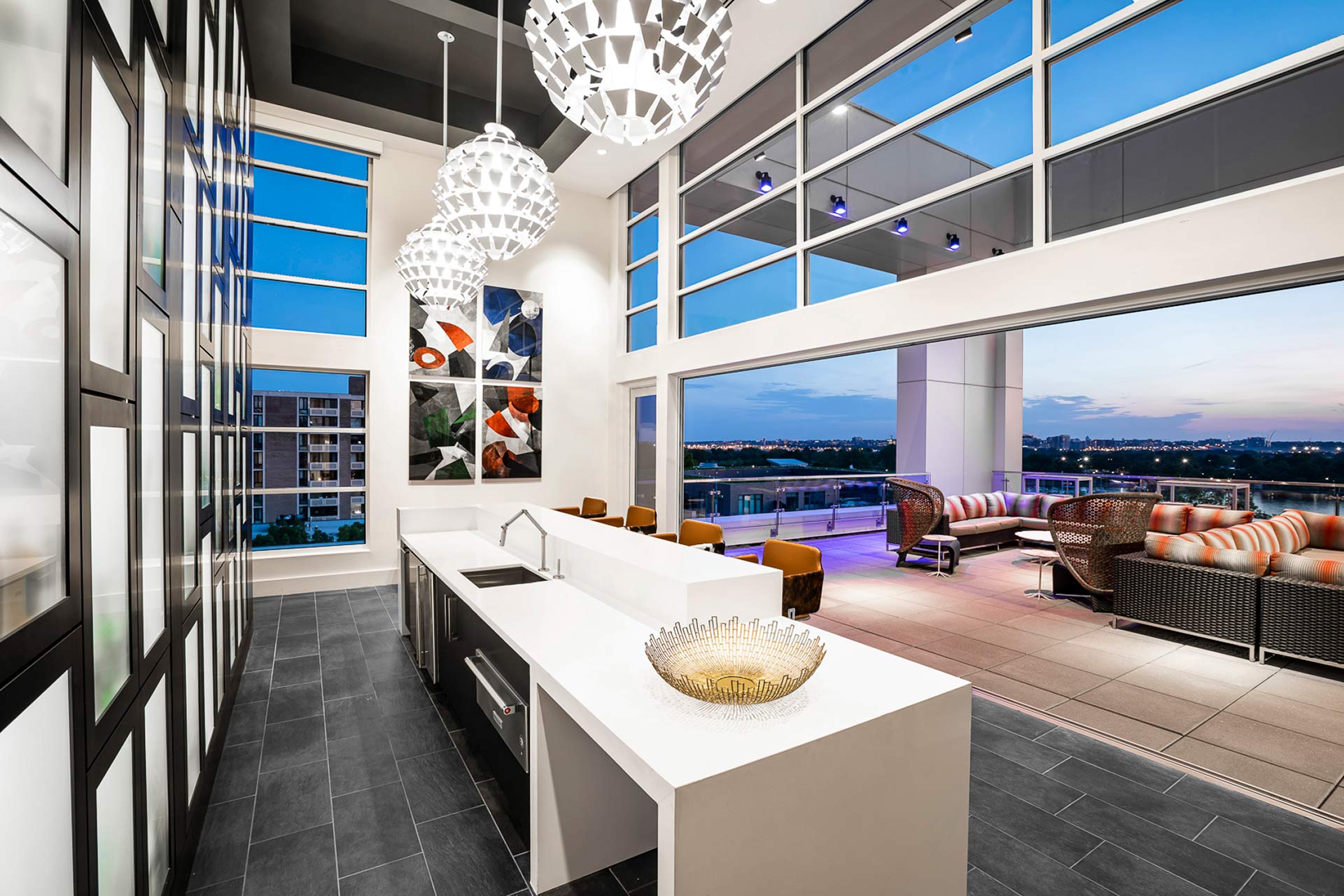 Take the elevator to the rooftop to enjoy a cocktail and snacks with guests.